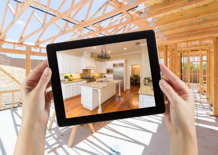 photo of woman holding a tablet to help design new home