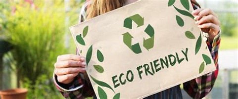 Photo of girl holding ECO FRIENDLY sign